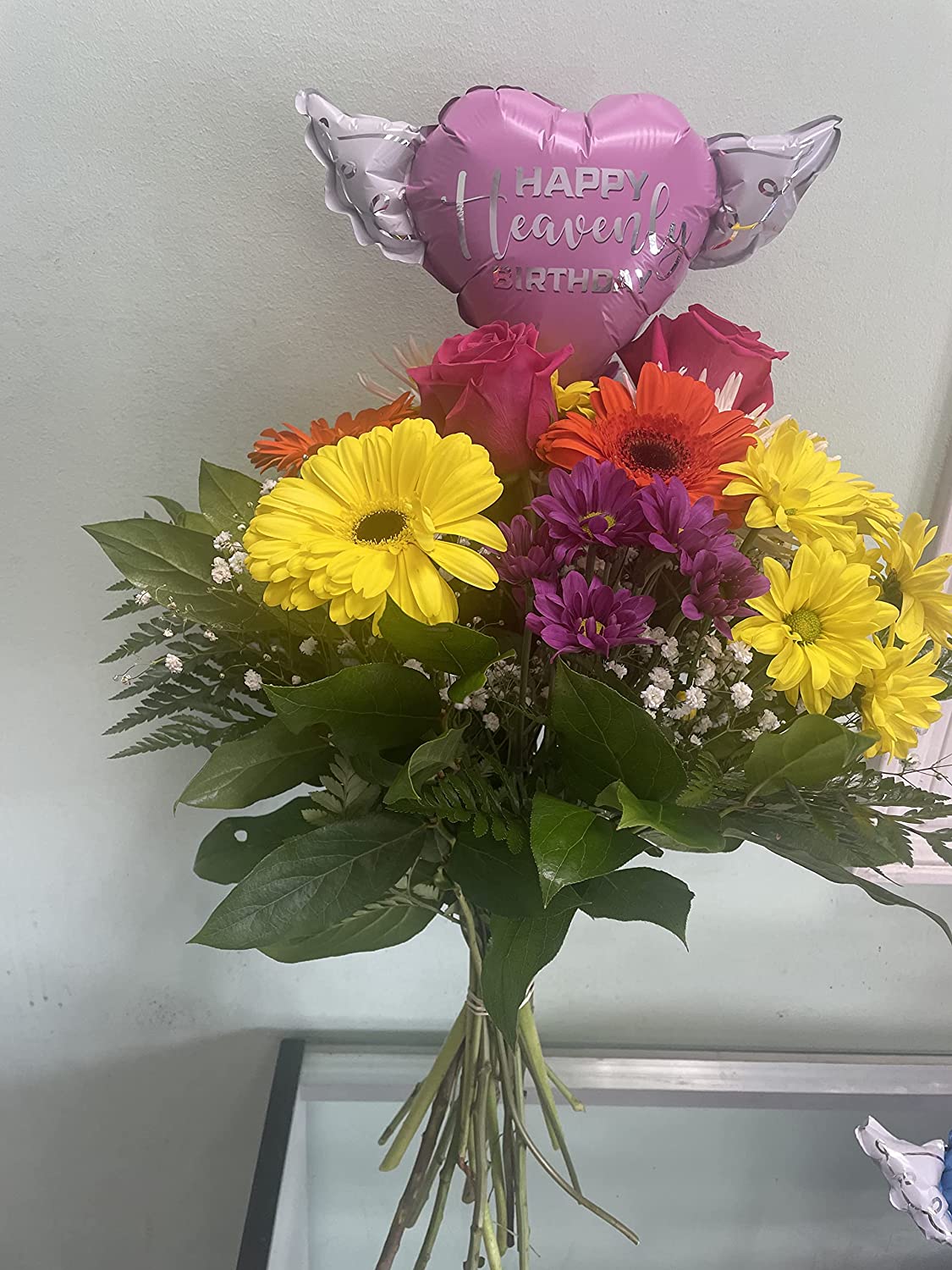 Happy Heavenly Birthday pink balloons on a stick heart shaped with angel wings + bouquet of flowers