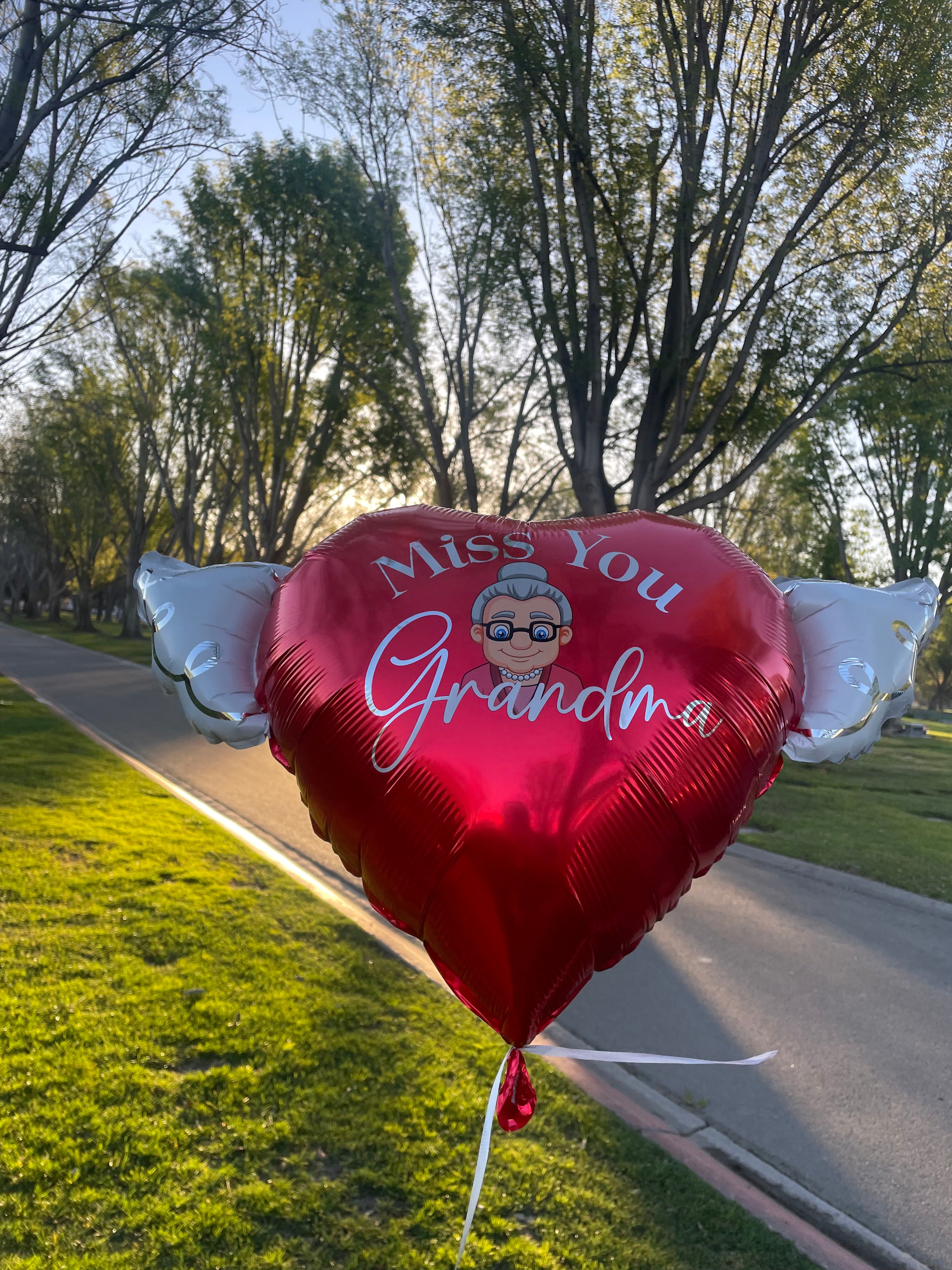Miss You Grandma Memorial Balloon placed at a cemetery graveside