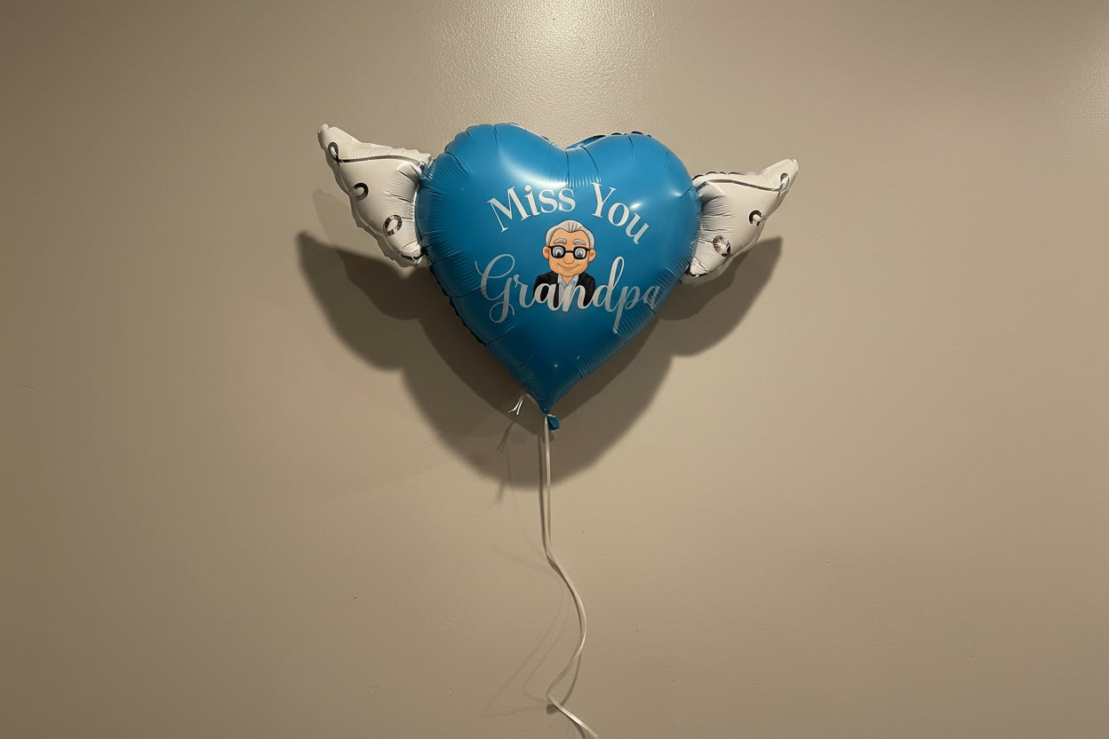 Inflated miss You Grandpa Memorial Balloon displayed on a wall – view 3