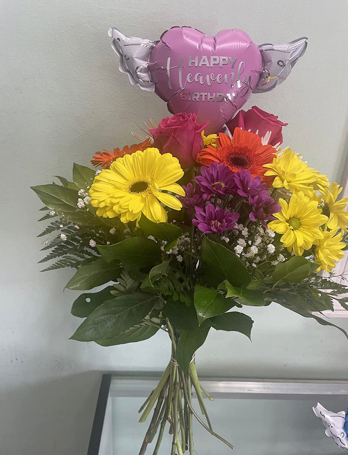 Happy Heavenly Birthday pink balloons on a stick heart shaped with angel wings + bouquet of flowers