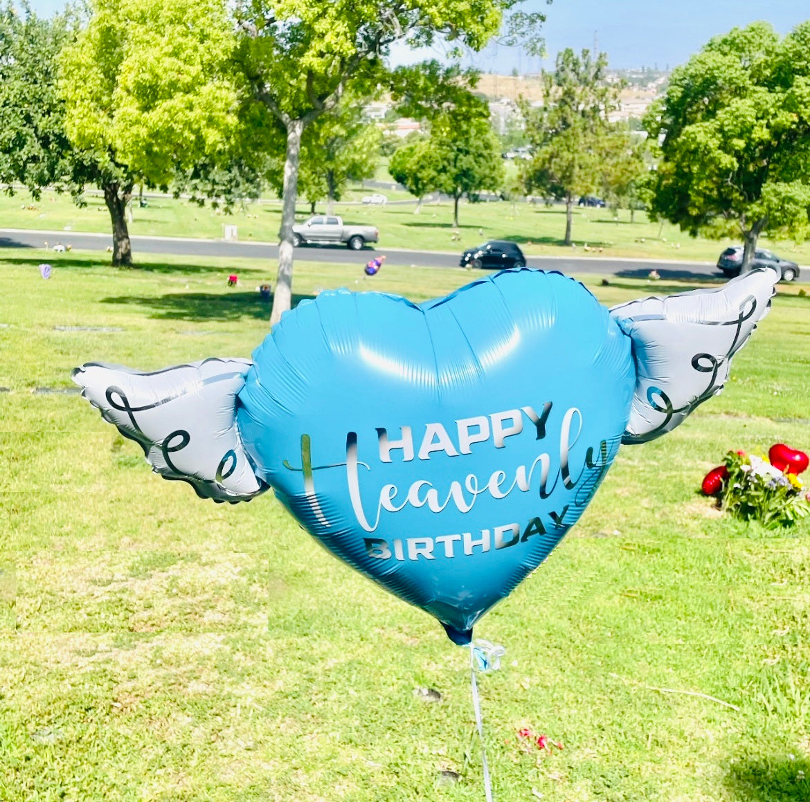 Heart-Shaped Blue Happy Heavenly Birthday Balloon with white angel wings